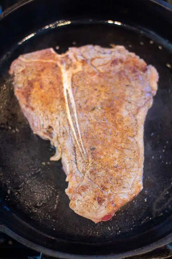 Process image 3 showing searing other side of t bone steak.