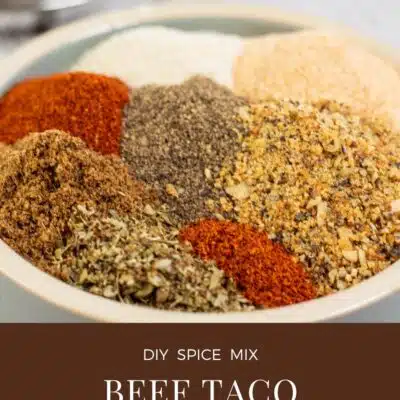 Pin image with text showing a small bowl with beef taco seasoning.