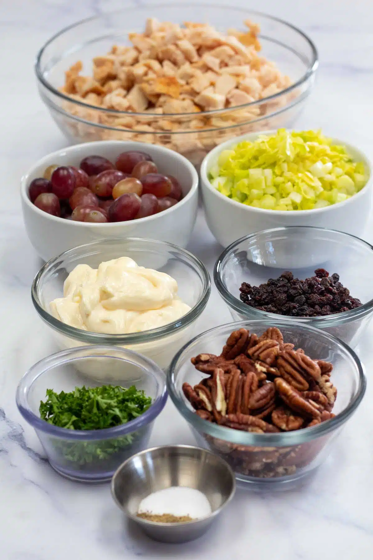 Tall image showing ingredients for chicken salad and grapes.