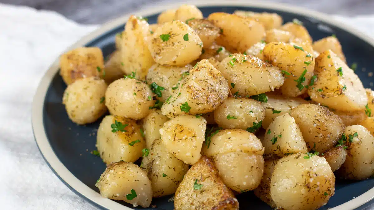 Wide image showing cooked canned potatoes.