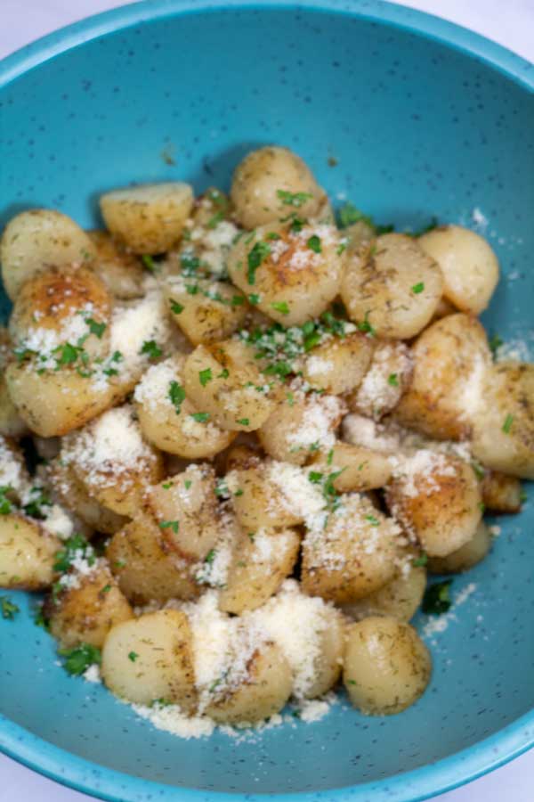 Process image 8 showing cooked potatoes in a bowl with Parmesan.