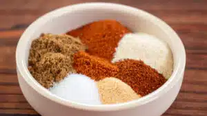 Wide image of fajita seasoning spices in a small bowl.