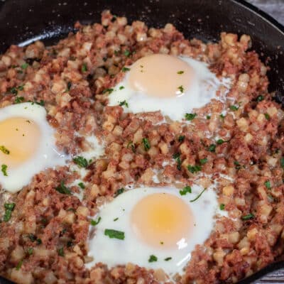 Square image showing canned corned beef hash and eggs.
