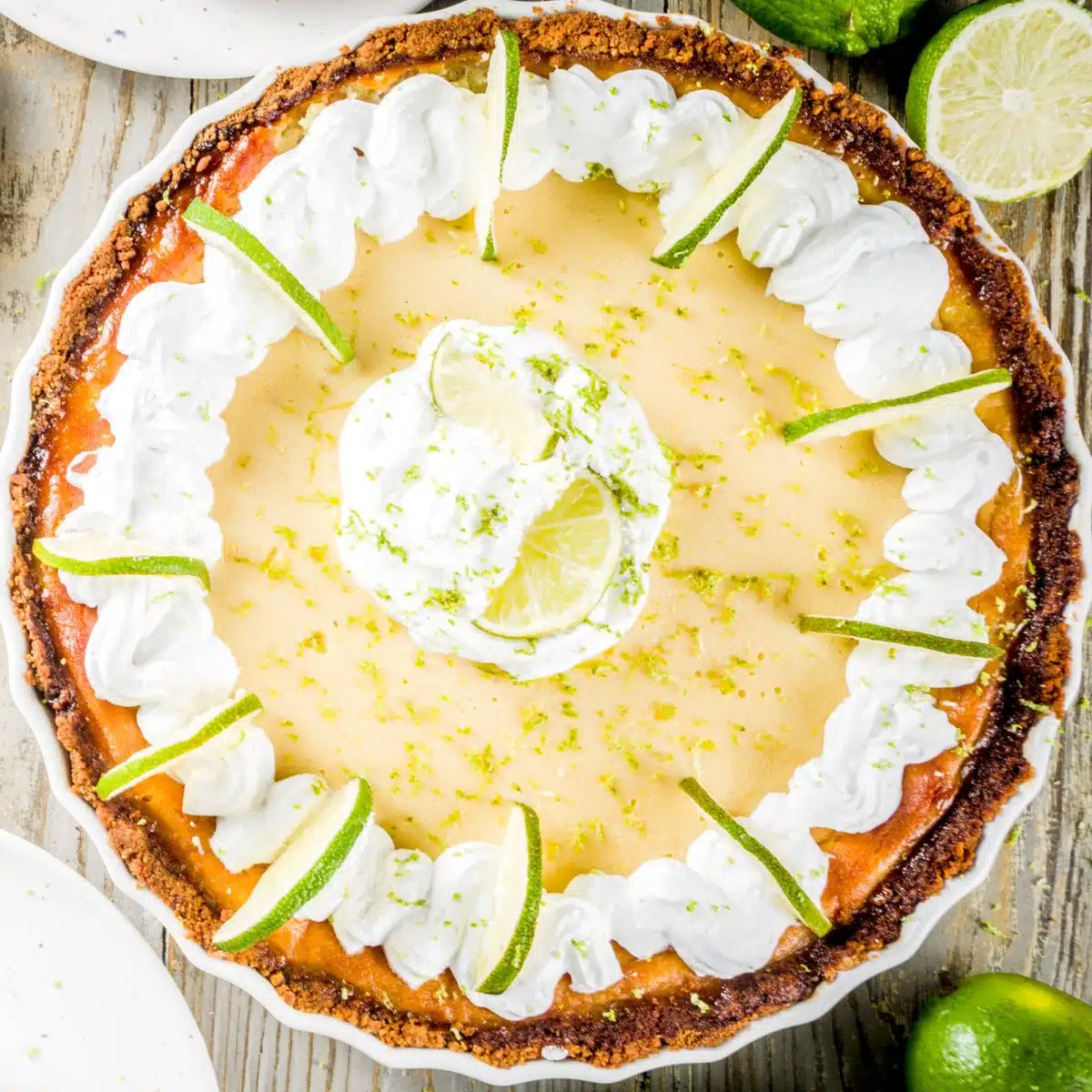 Square image of a whole key lime pie.