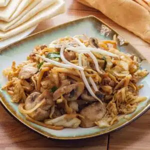 Square image of a plate of moo shu pork.
