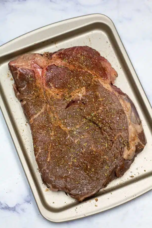 Process image 1 showing seasoned top sirloin steak.
