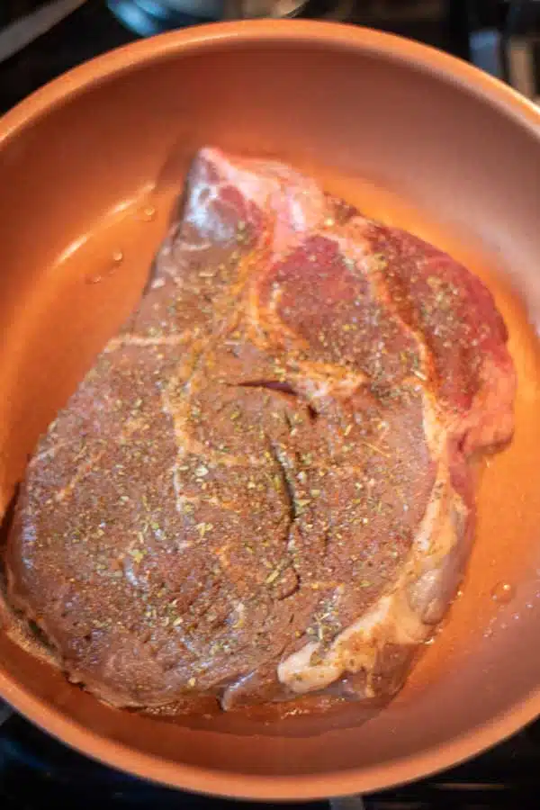 Process image 2 showing pan searing top sirloin steak.