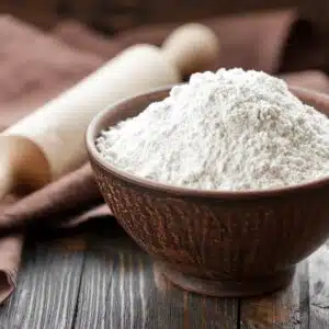 Square image of self rising flour in a bowl.