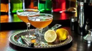 Wide image showing a classic sidecar cocktail.