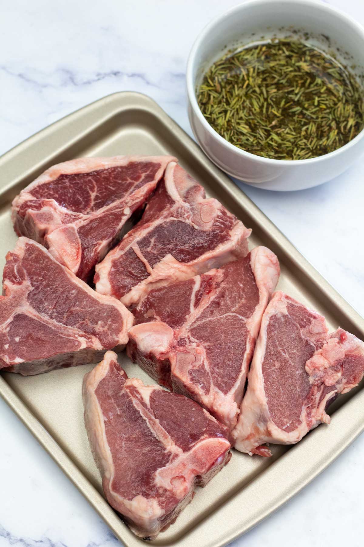 Tall image showing sous vide lamb chops ingredients.