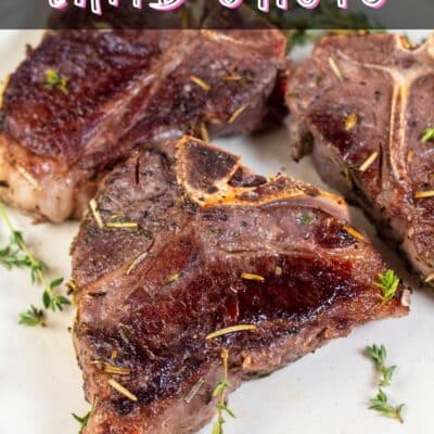 Pin image with text showing sous vide lamb chops on a white plate.