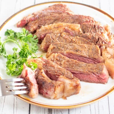 Square image of sliced sous vide ribeye steak.