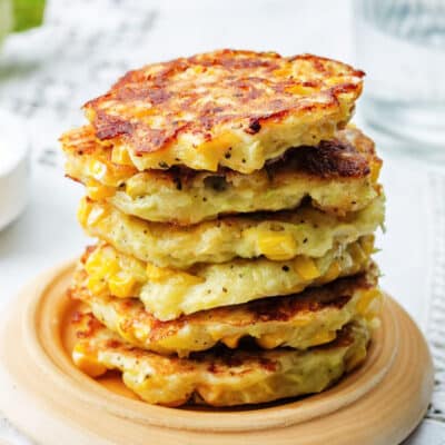 Square image of a stack of Southern corn fritters.