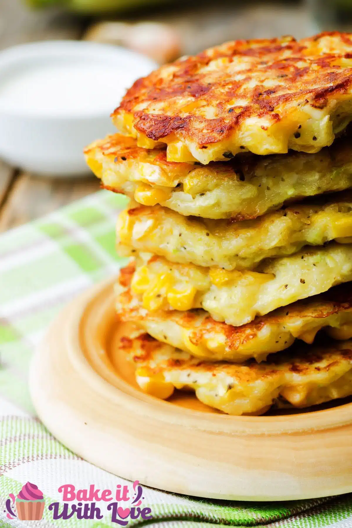 Tall image of a stack of Southern corn fritters.