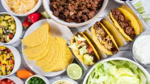 Wide image of a taco bar layout.