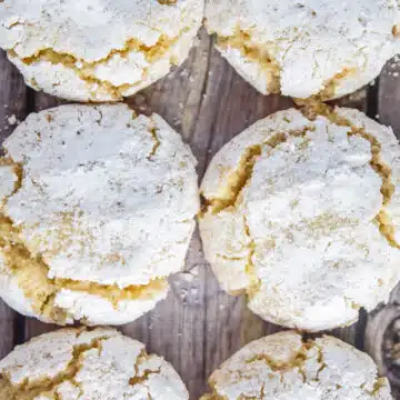 best amaretti cookies recipe baked up until perfect with crinkle cookie appearance on wooden background.