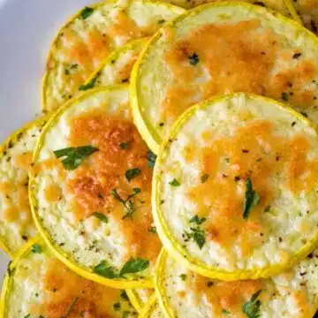 Wide image showing baked Parmesan yellow squash.