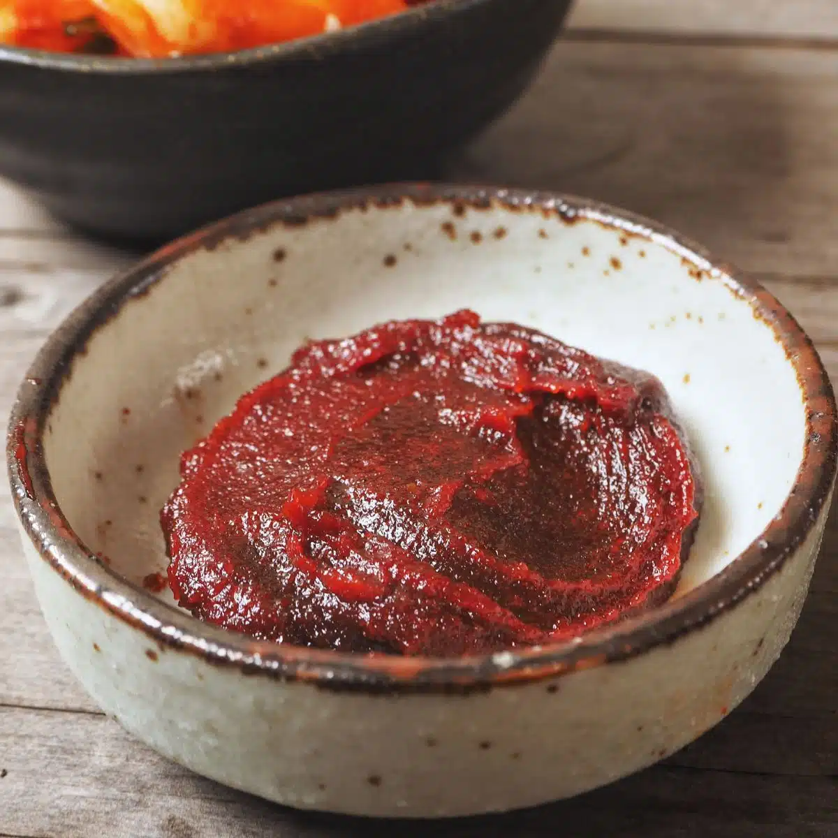 Square image showing Gochujang in a small bowl.