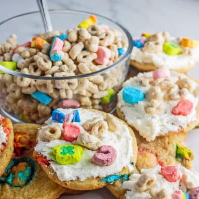 Best Lucky Charms cookies topped with rich cereal milk buttercream frosting and more marshmallow cereal.