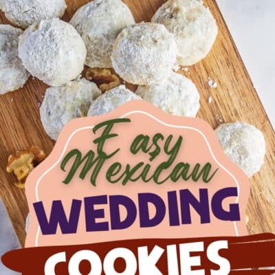 Best Mexican wedding cookies recipe pin with tasty cookies served on a wooden cutting board with extra walnuts scattered around them and text heading overlay.