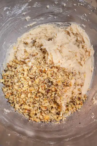 Mexican wedding cookies process photo 5 add the crushed walnuts to the combined cookie dough.