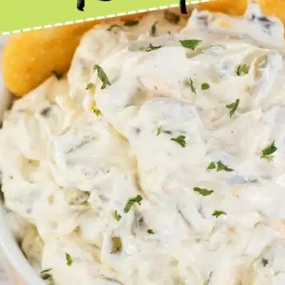Best olive dip recipe pin with the dip served in a white bowl with crackers and text title overlay.