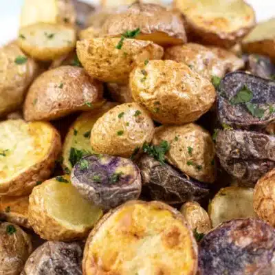 Pin image with text of a plate of air fryer baby potatoes.