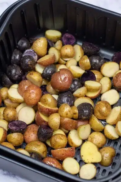 Process image 2 showing baby potatoes in the air fryer basket.