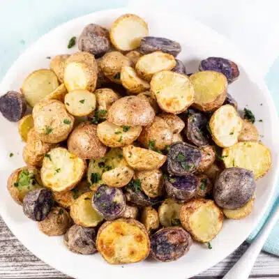 Square image of a plate of air fryer baby potatoes.