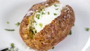Wide image of air fryer baked potato.