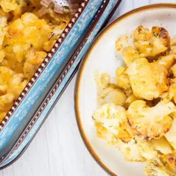 Wide image of plated cheesy baked cauliflower.