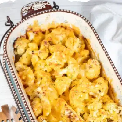 Pin image with text of cheesy baked cauliflower.