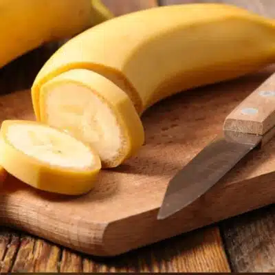 Best banana substitute and alternatives pin with a picture of sliced bananas with text title box below it.