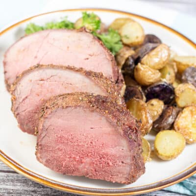 Square image of sliced beef top round roast.