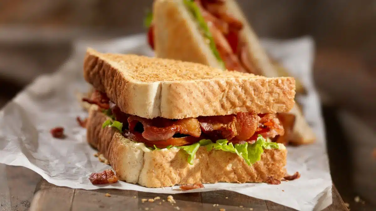Wide image showing a classic BLT sandwich.