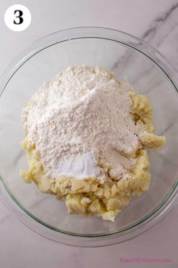 Boxty Irish pancakes process photo 2 showing mashed potatoes and flour in a bowl. 