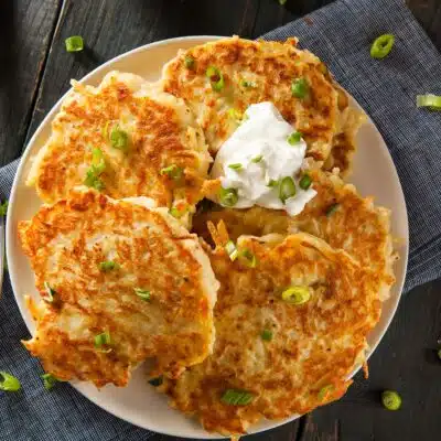 Square image of boxty Irish pancakes on a white plate.