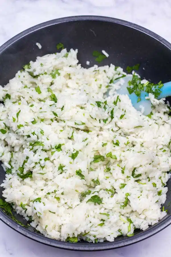 Process image 3 showing mixed chopped cilantro and rice.