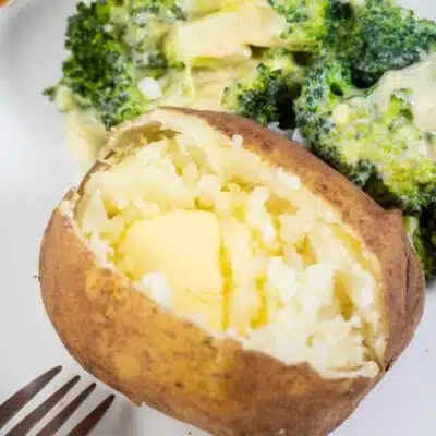 Tall image showing a plate with a instant pot baked potato and broccoli on the side.
