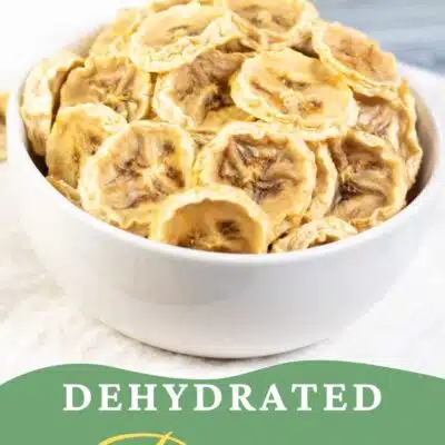 Pin image with text showing a bowl full of dehydrated banana chips.