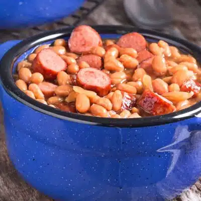 Square image of a pot of franks and beans.