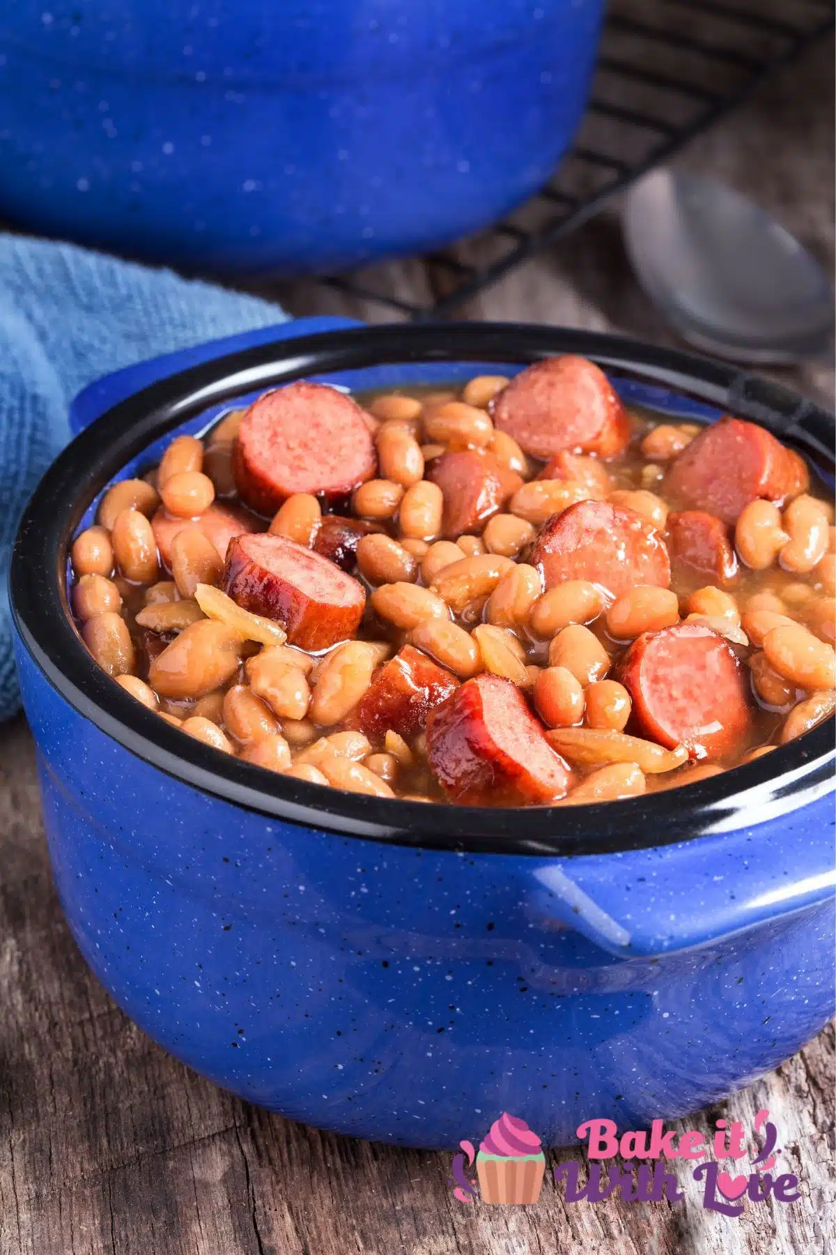 Tall image of a pot of franks and beans.