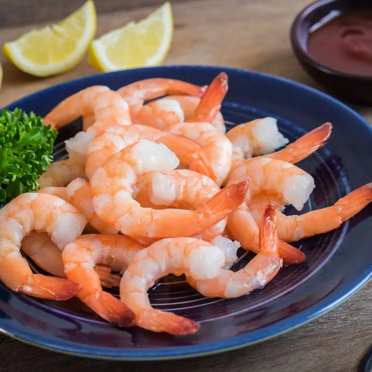 Square image of shrimp on a plate.