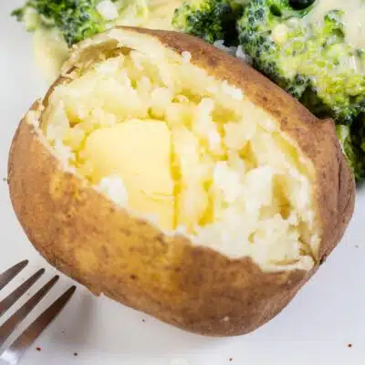 Baked potato on plate.