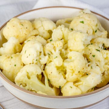 Wide image of a bowl with instant pot cooked cauliflower.