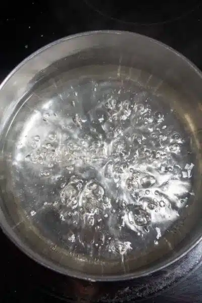 Process image 4 showing boiling sugar in water, making syrup.