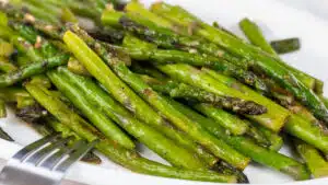 Wide image of pan fried asparagus.