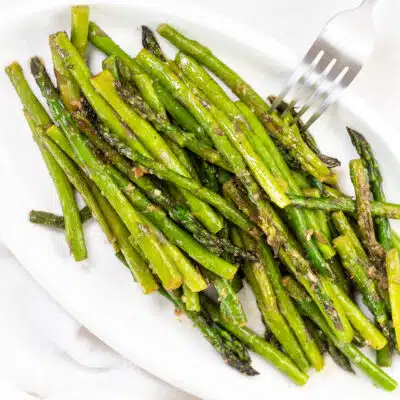 Square image of pan fried asparagus.