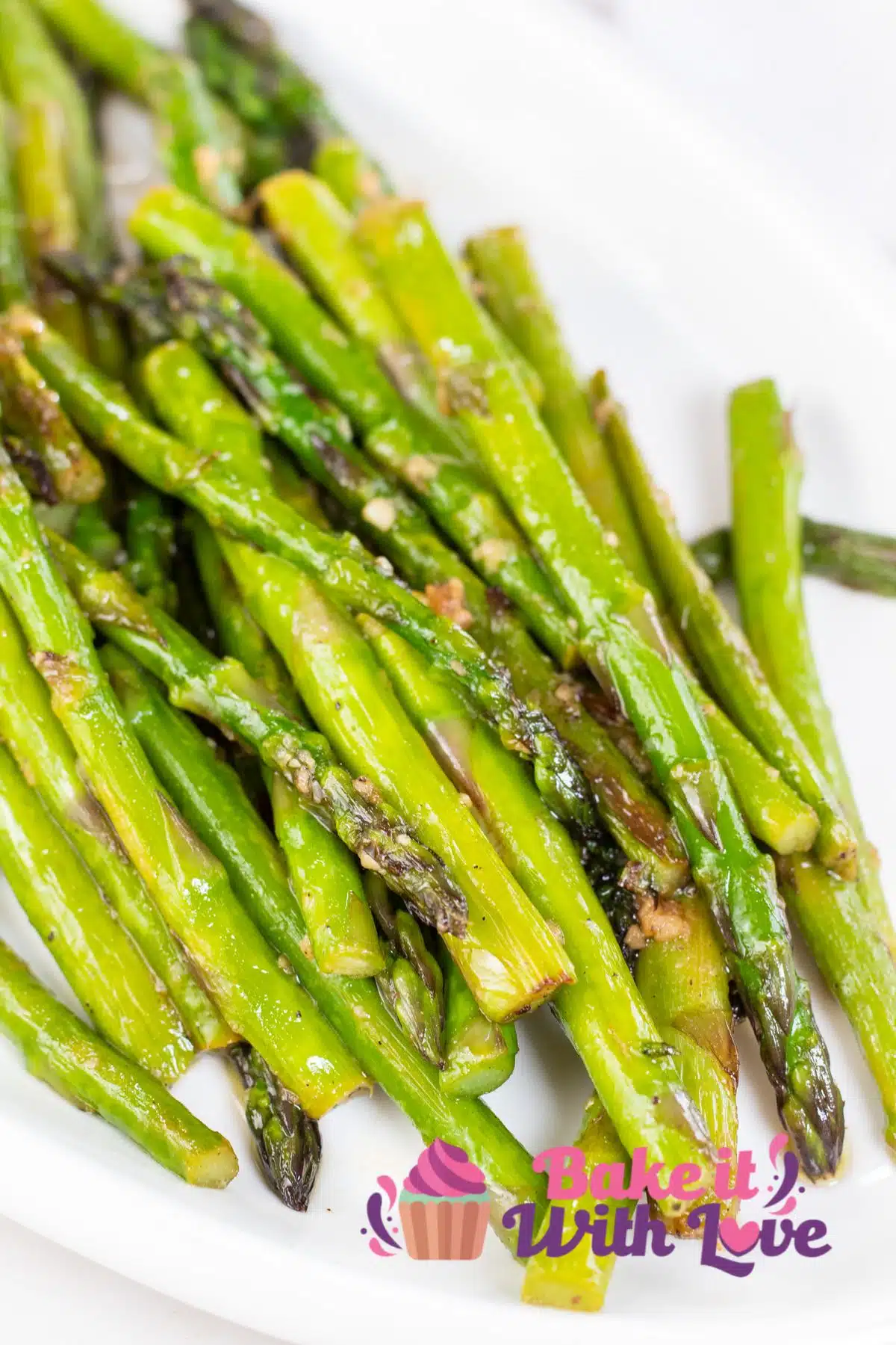 Tall image of pan fried asparagus.