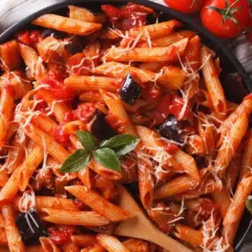 Wide image of pasta alla norma.